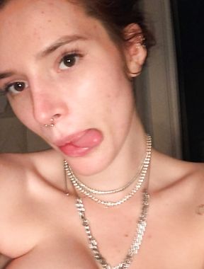 Bella Thorne strips topless and goes nude